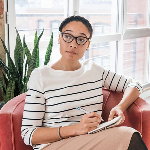 Female manager listening to her employee talk about stress.