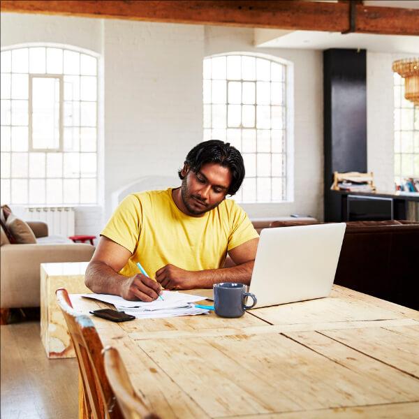 Man filling paperwork.