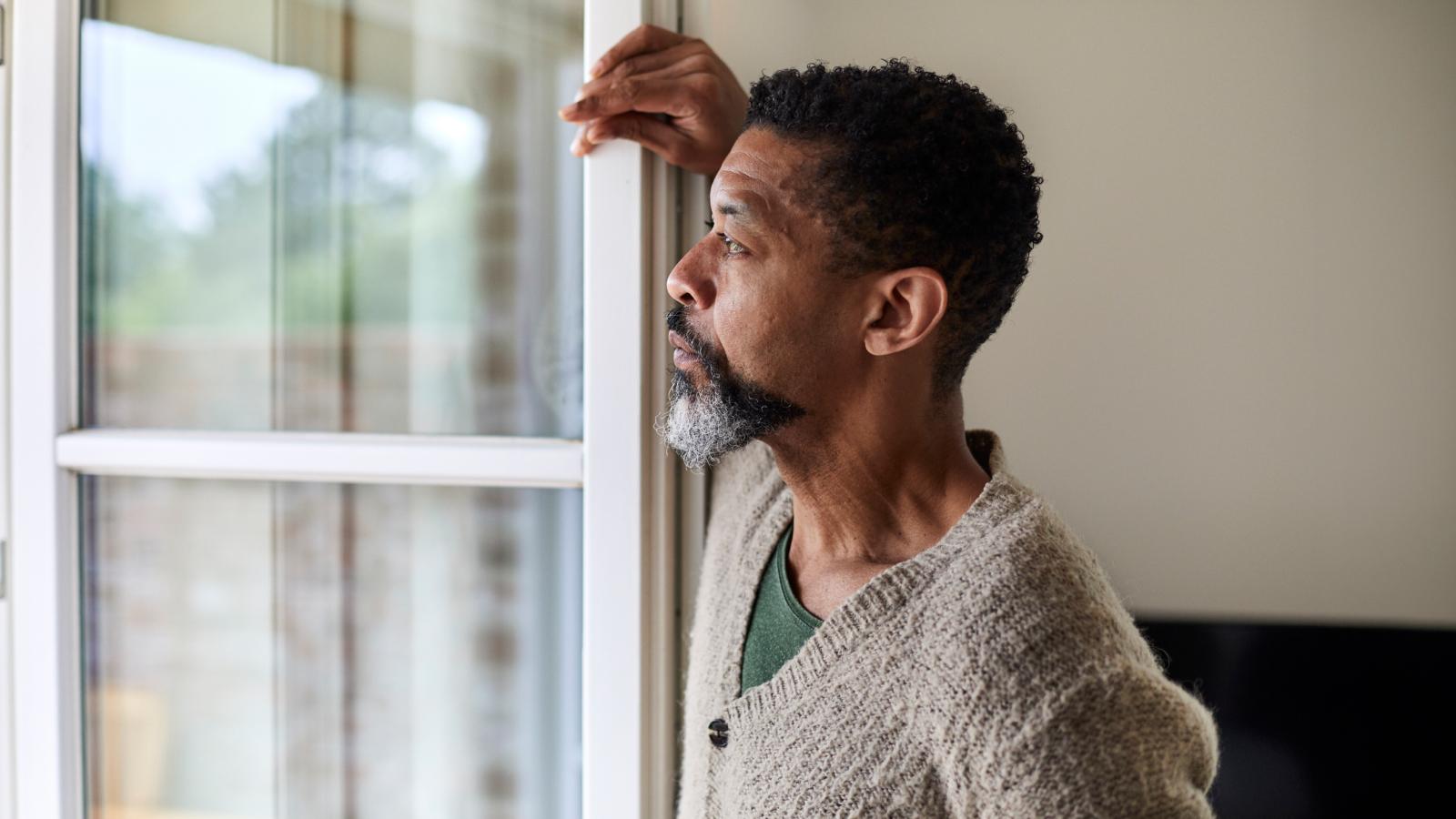 Man looking out of window