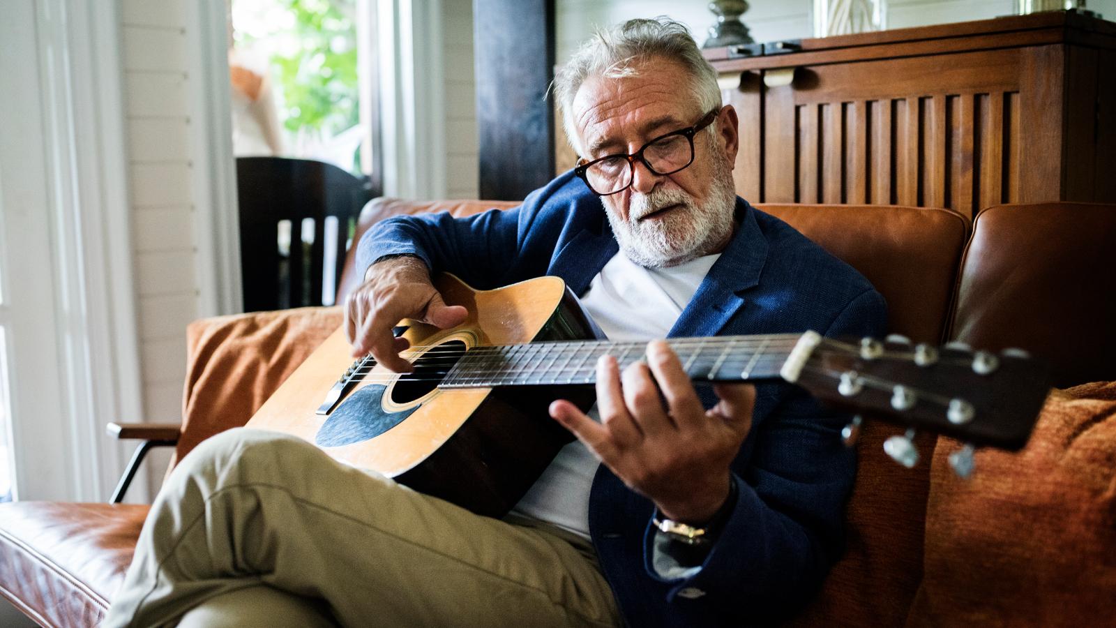 Old man playing guitar
