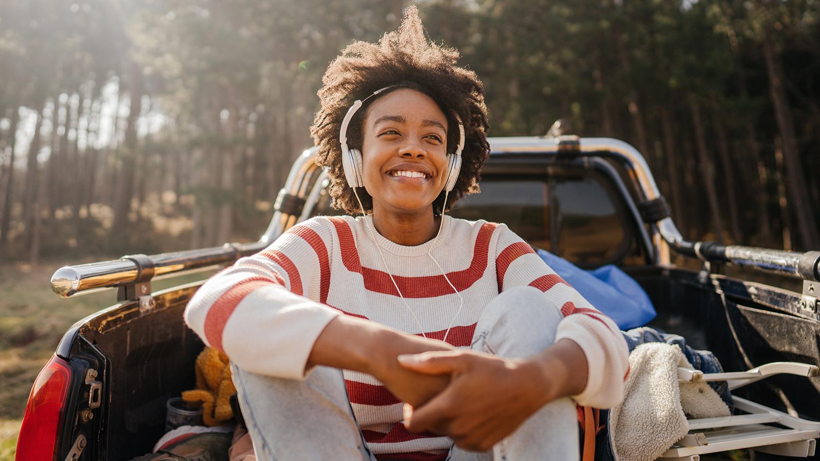 Girl smiling wearing apple airpods max