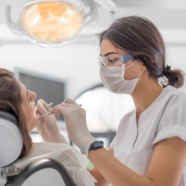 A dentist providing services.