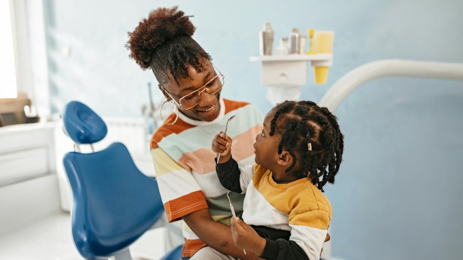 mother sitting and holding her kid