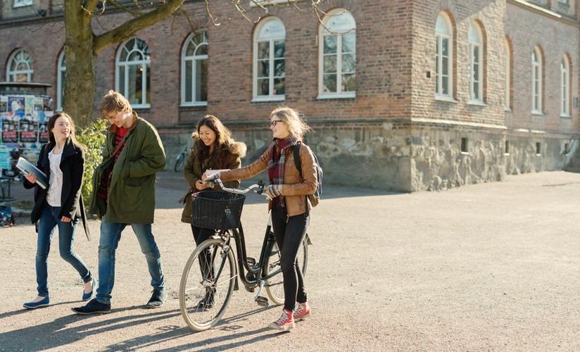 Students walking on college campus.