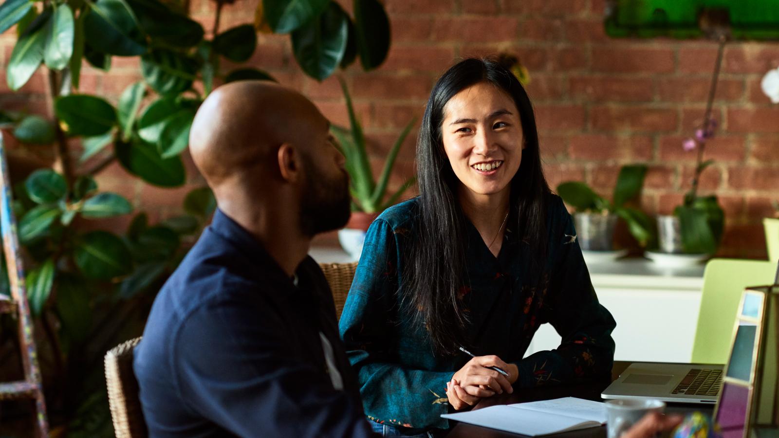 Two colleagues having a discussion in the office