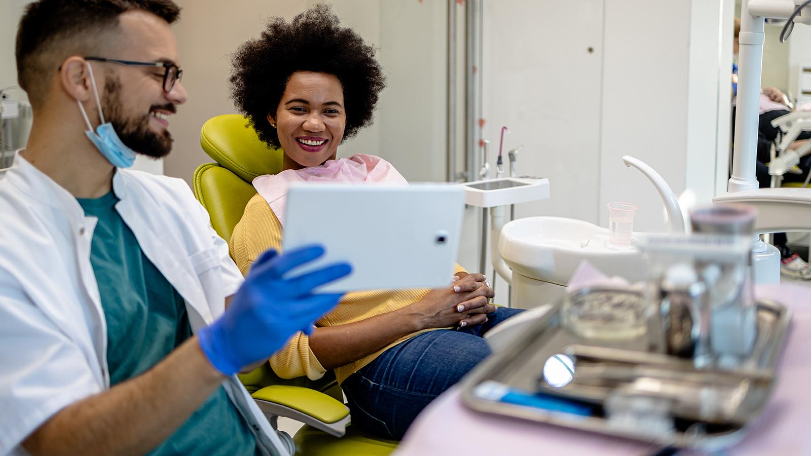 Dentist showing a patient her x-rays.
