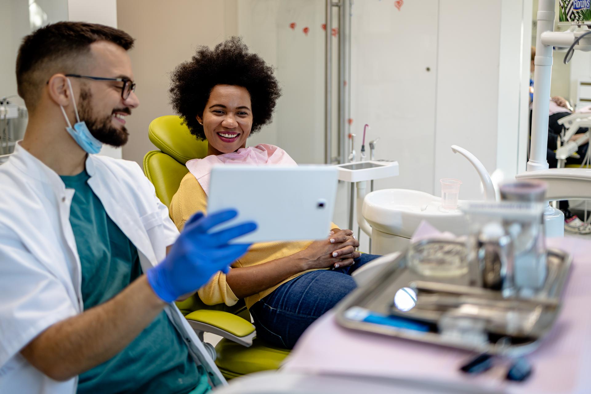 Dentist showing a patient her x-rays.