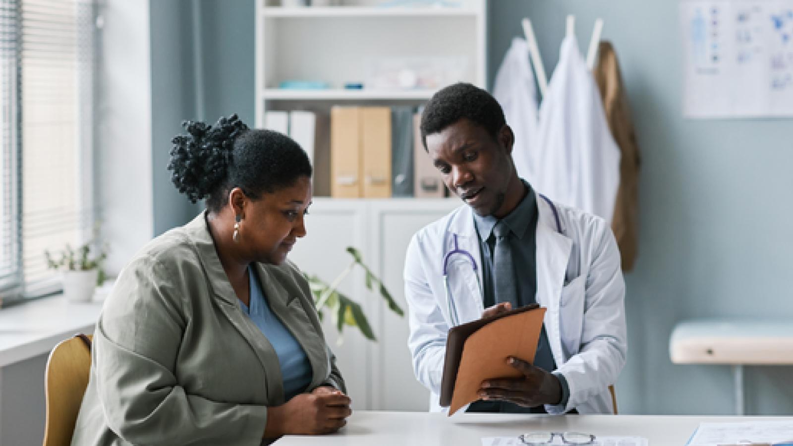 Woman consulting with a doctor about a treatment plan.
