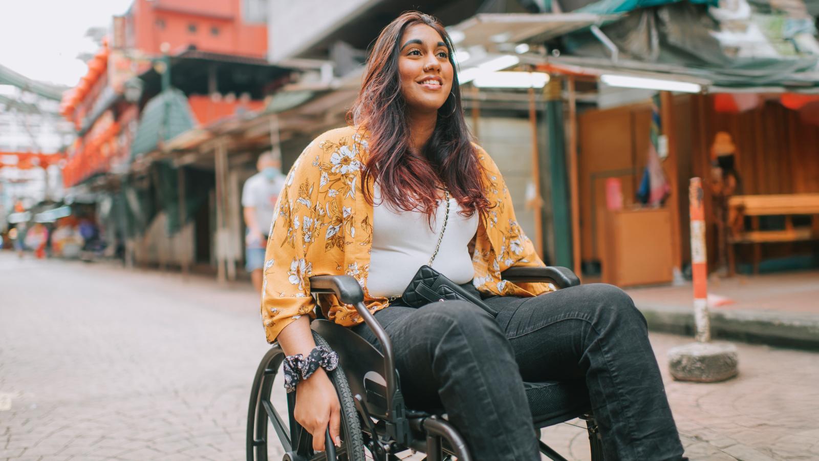 Woman with disability using wheelchair