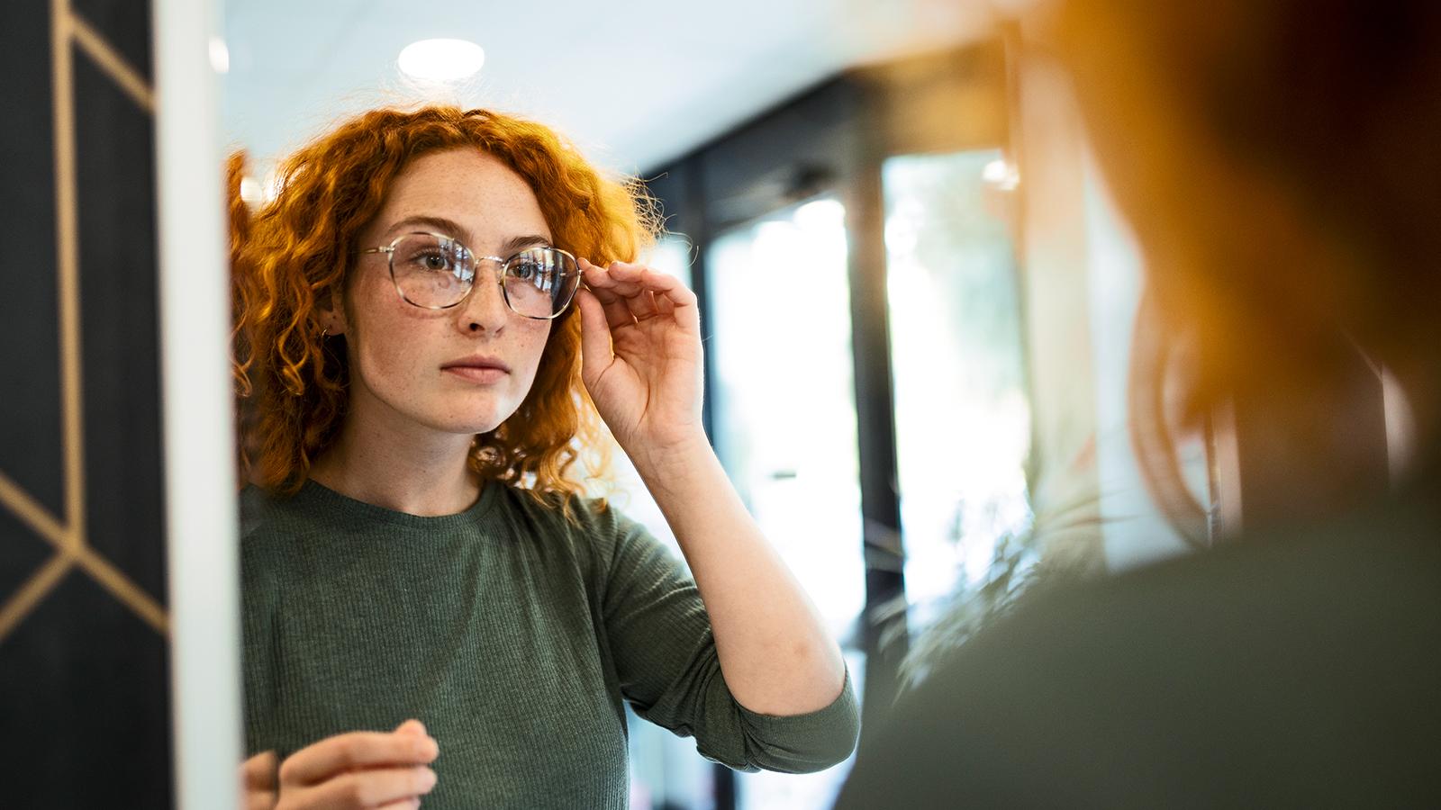Woman trying on a pair of glasses