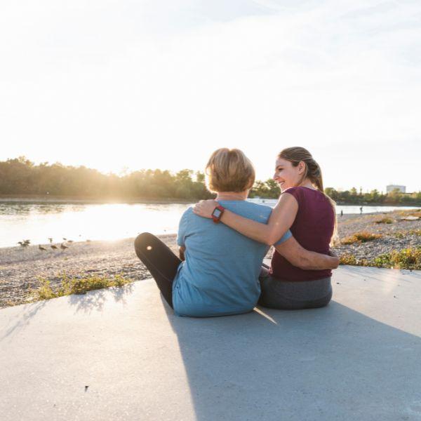 Mother and daughter hugging .