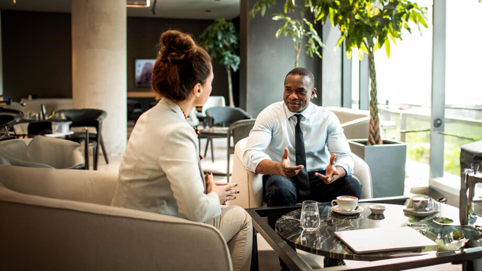 A financial representative talking to her client