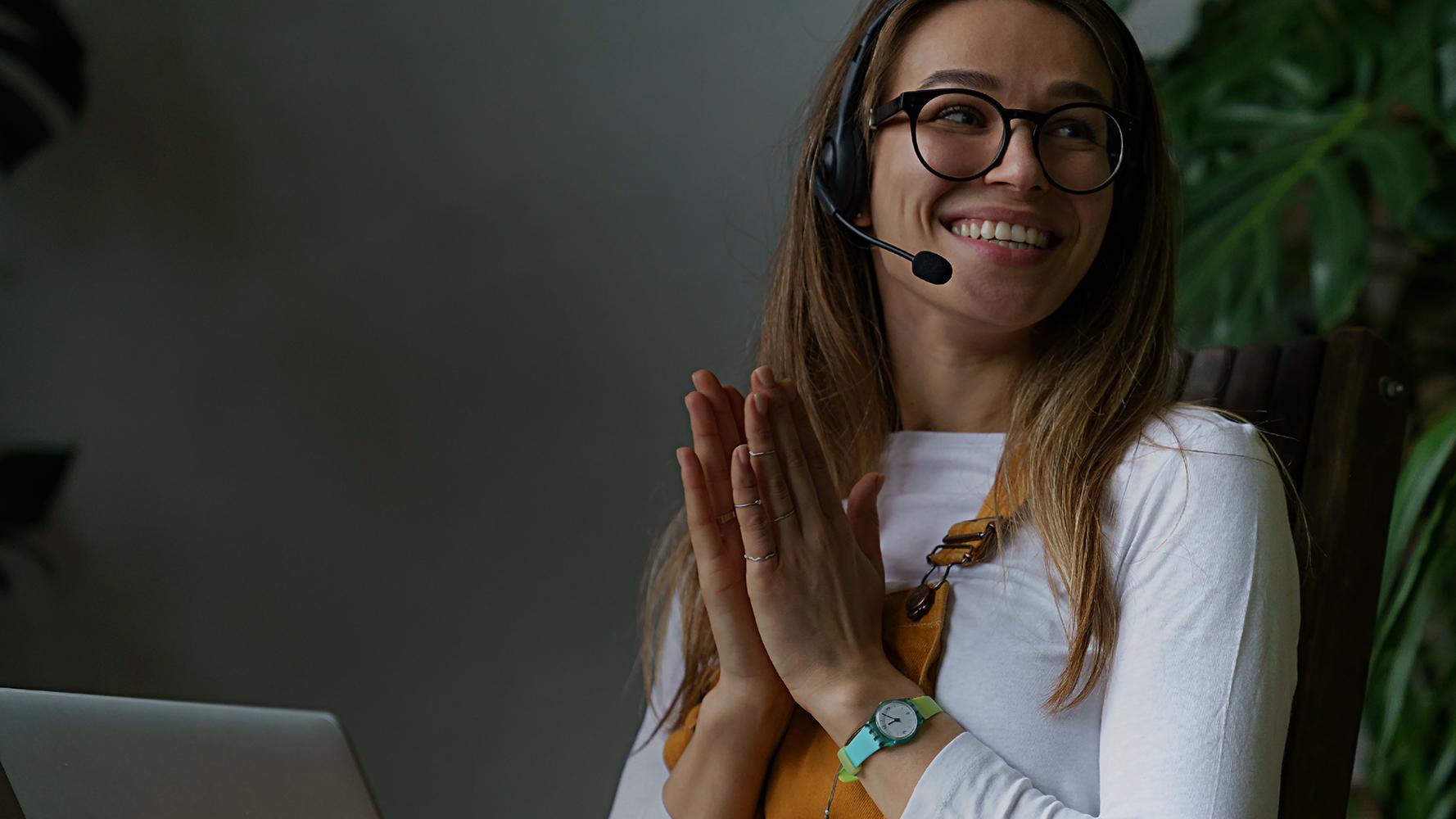 Woman smiling while using headphones Woman smiling while using headphones