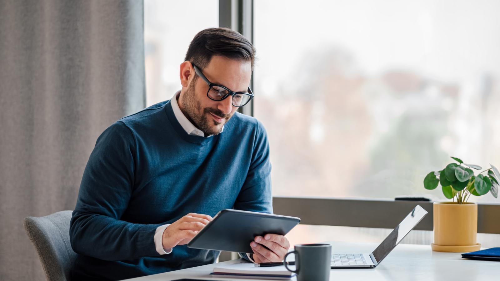 Businessman using digital tablet in office