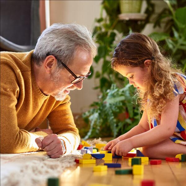 Grandfather playing with a kid.