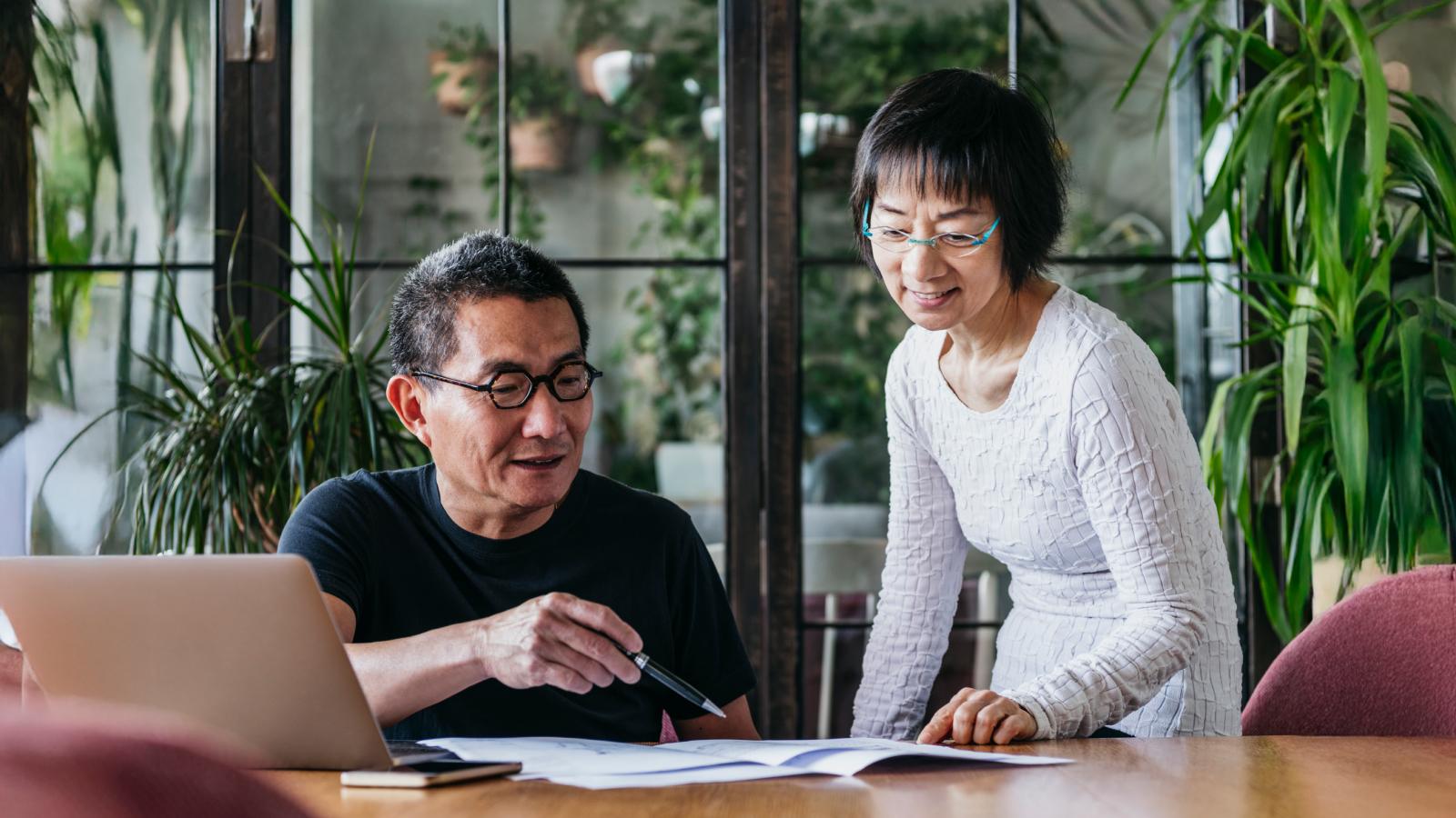 Couple at home with paperwork