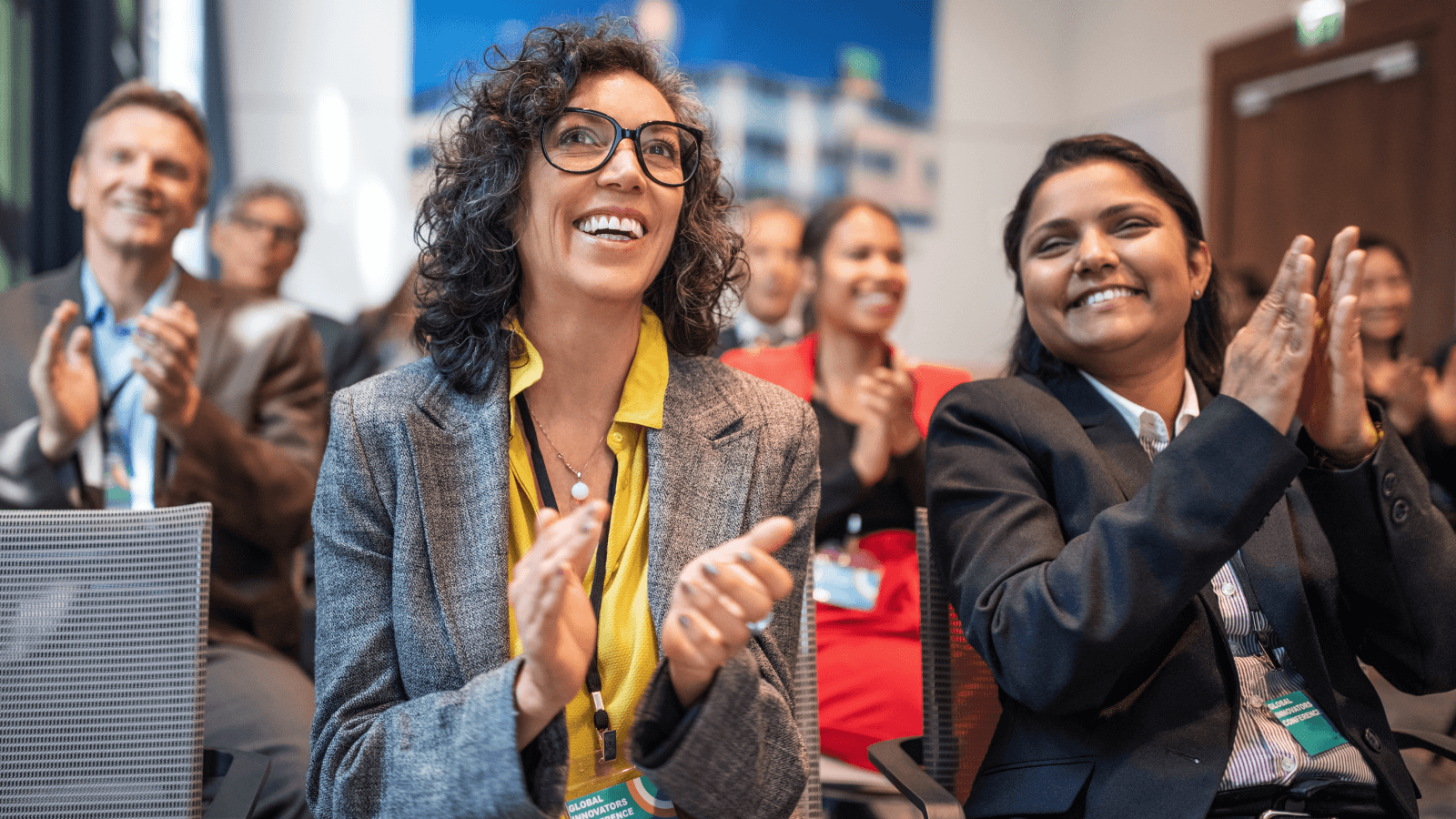 Colleagues clapping in an event