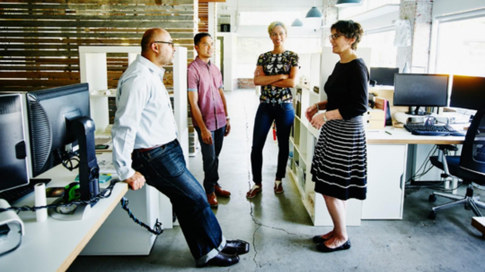 Colleagues discussing in an office