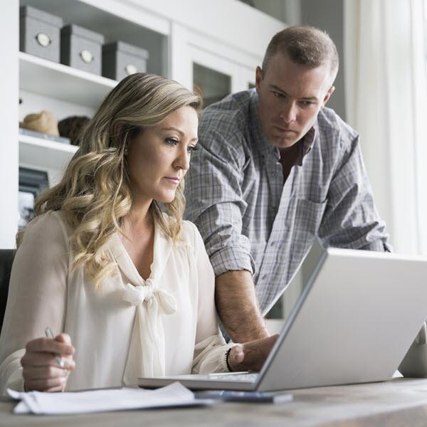 Man and woman at laptop.