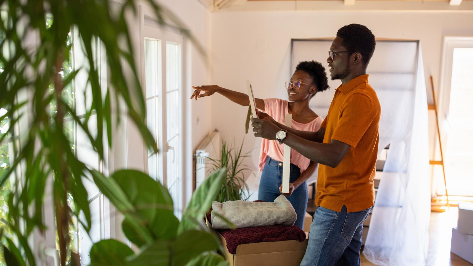 Couple decorating home