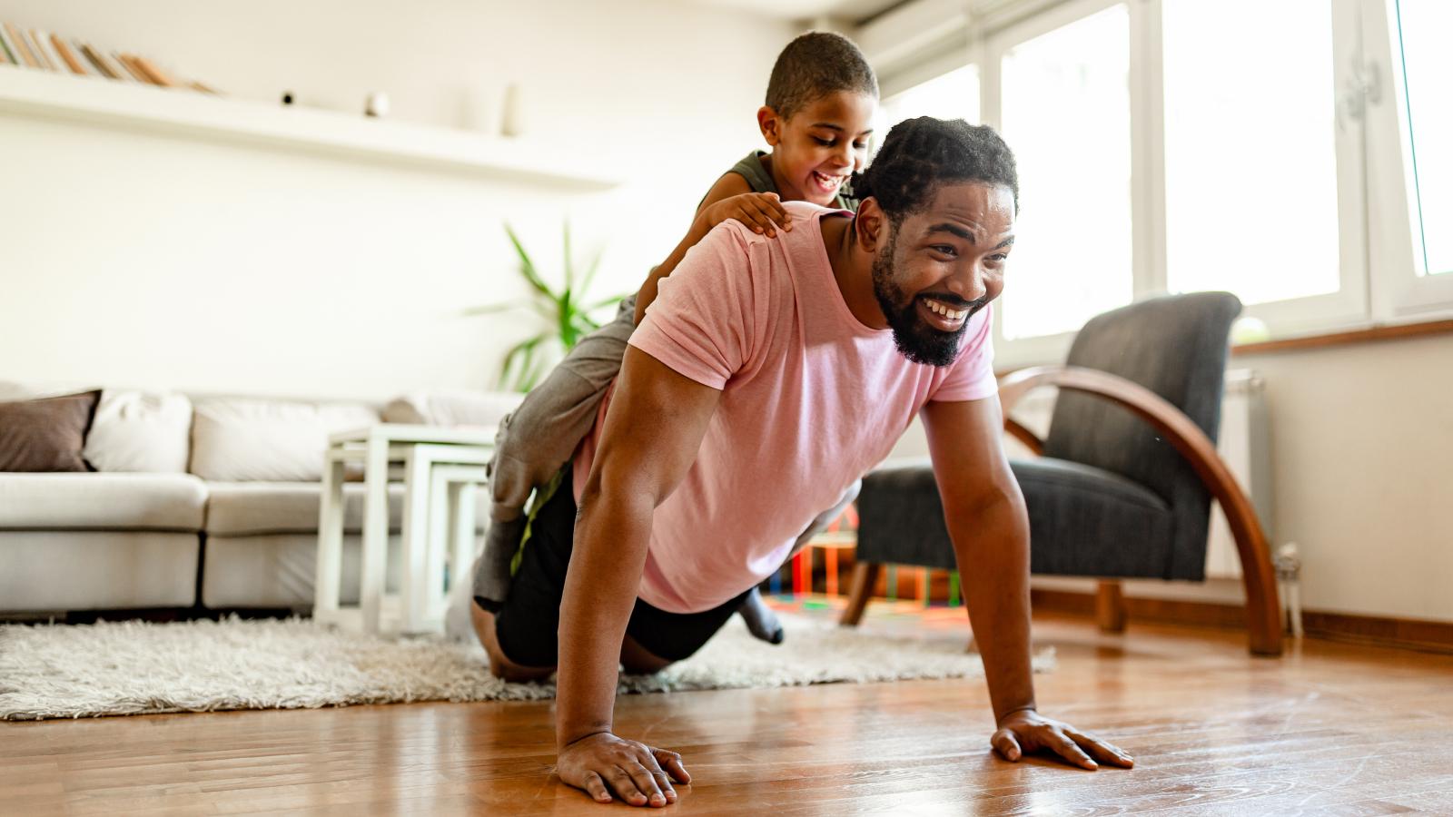 Father and son home exercising