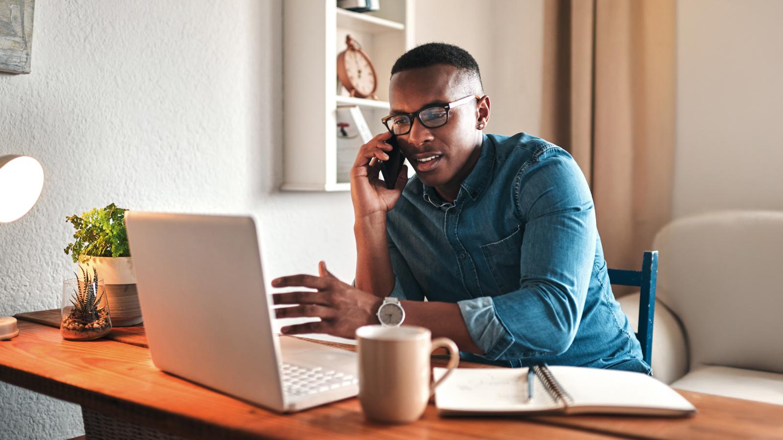 Young man sitting in home office