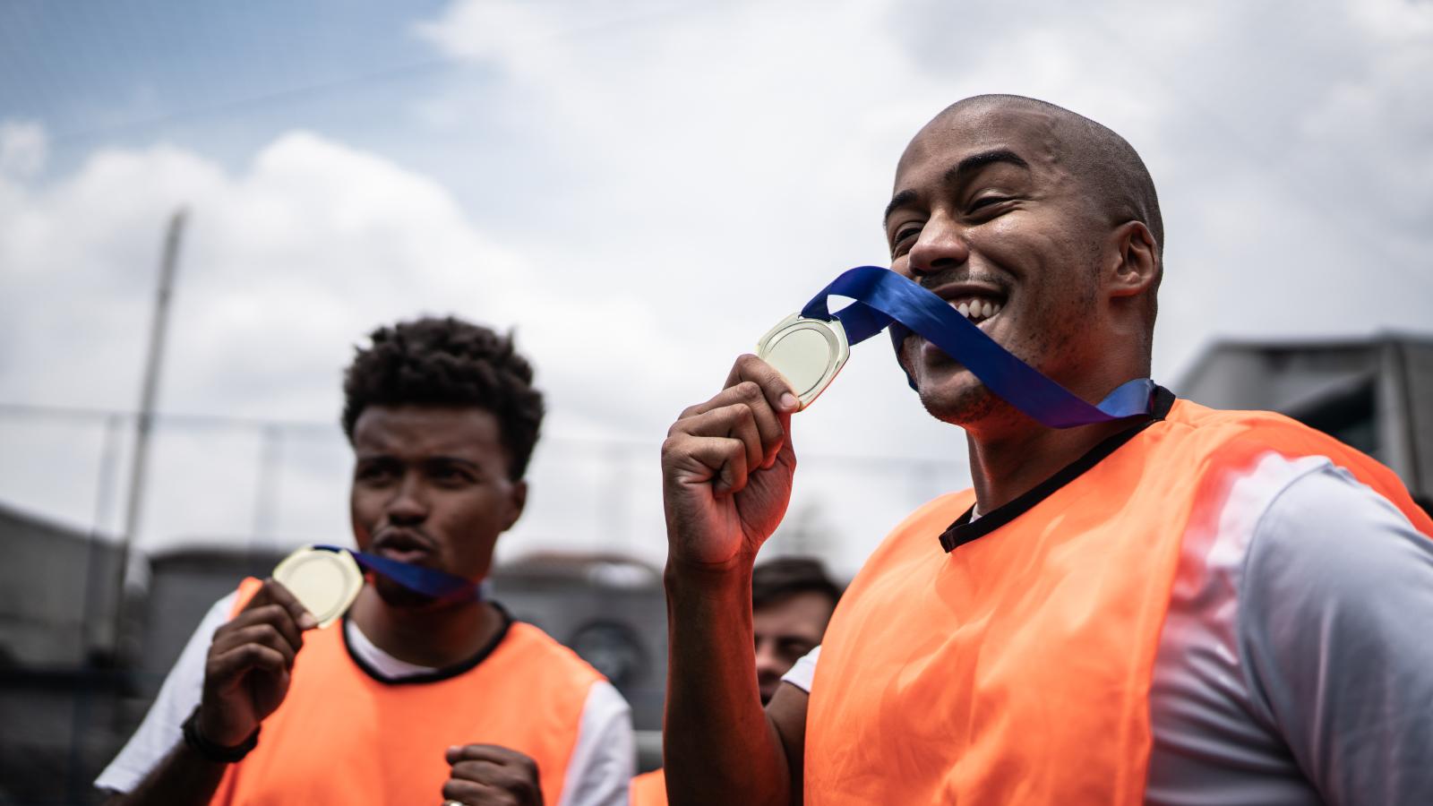 Players celebrating winning a medal