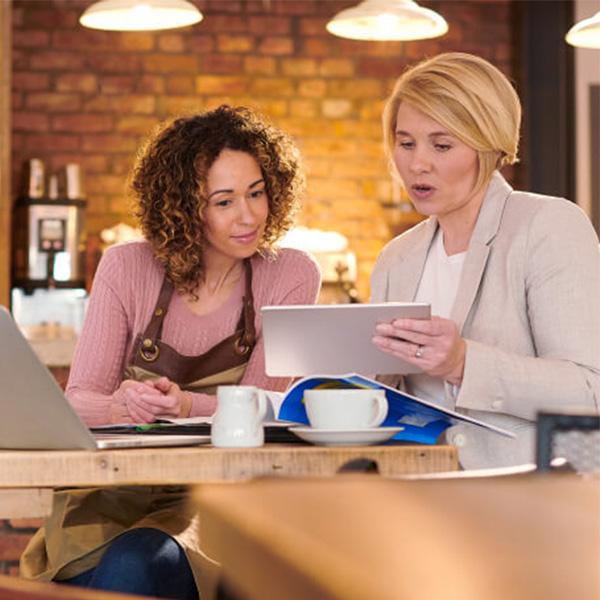 Small business owner meeting with financial advisor.