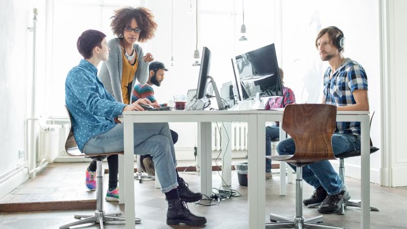 team-discussing-tech-strategy-best-practices-in-office