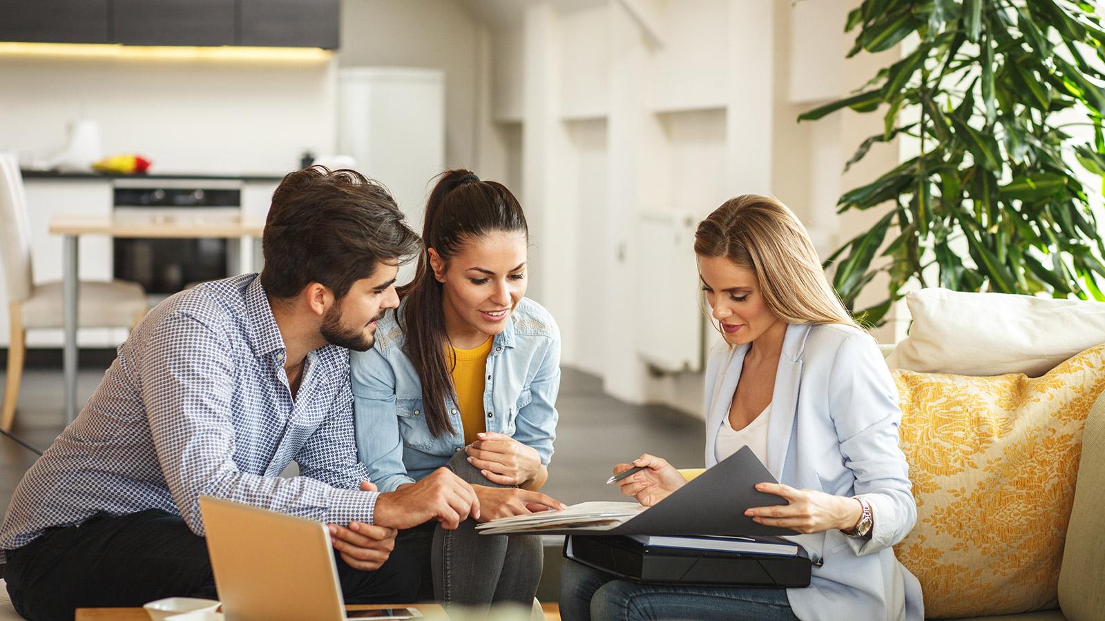 Three professionals discussing