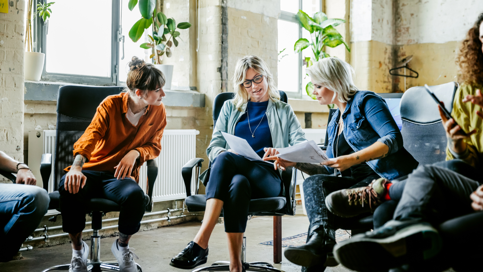 Casual businesswomen discussing during meeting