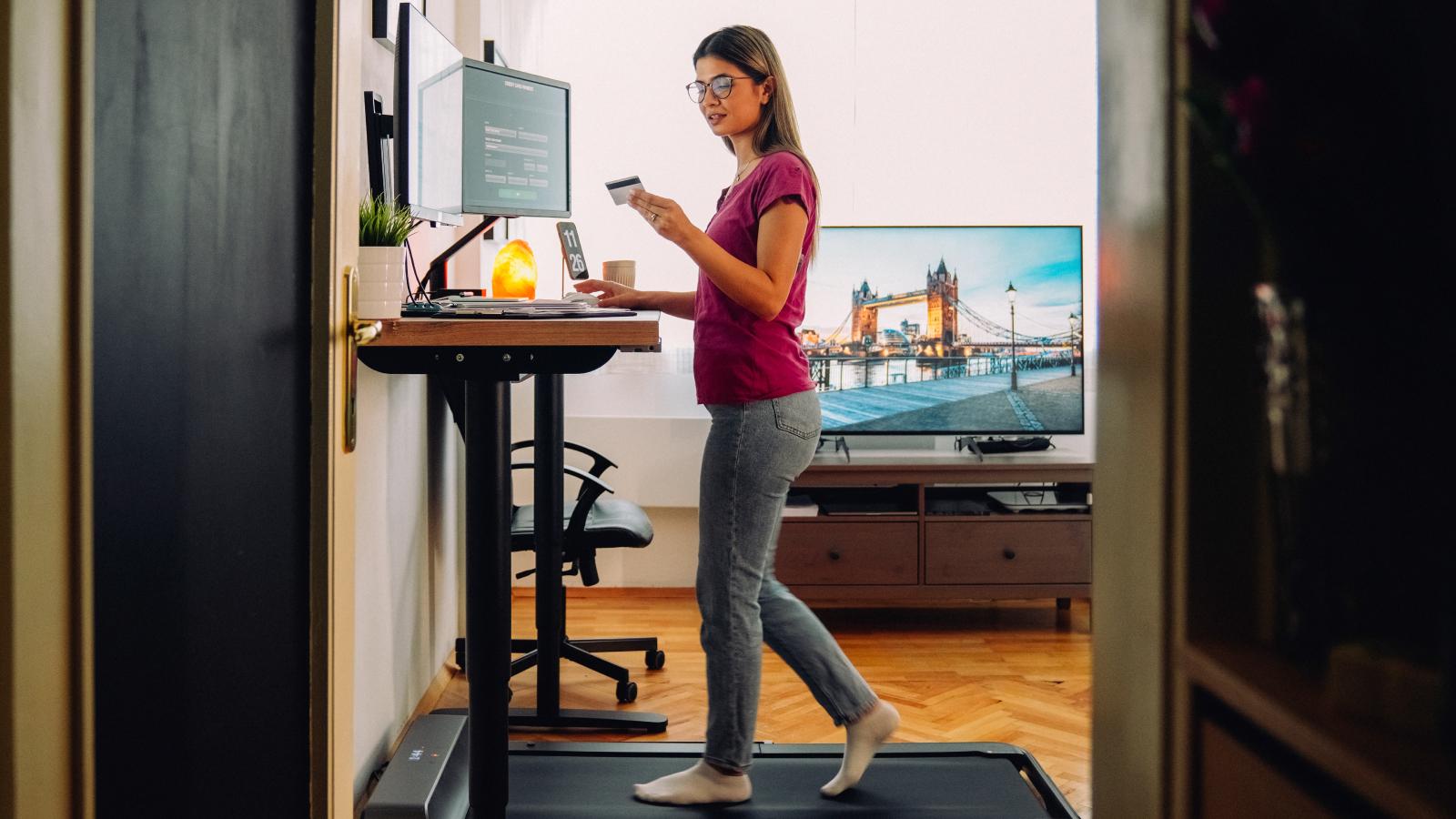 Woman working at a standing desk at home.