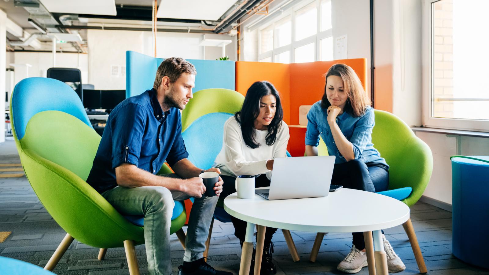 Three business employees sitting together