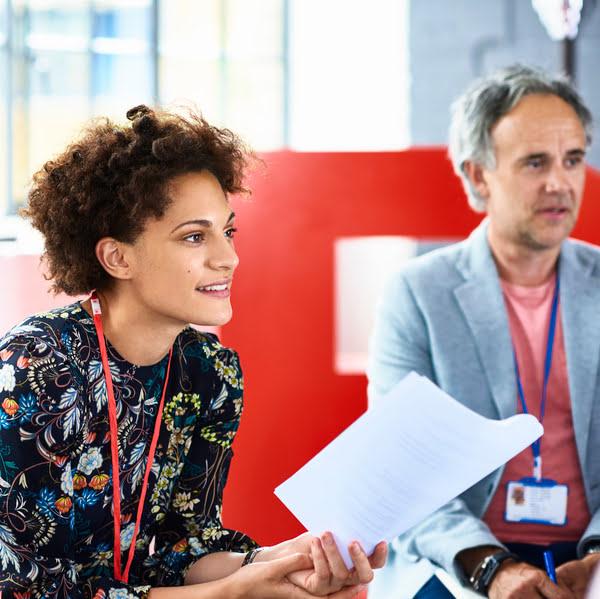 Woman holding paper.