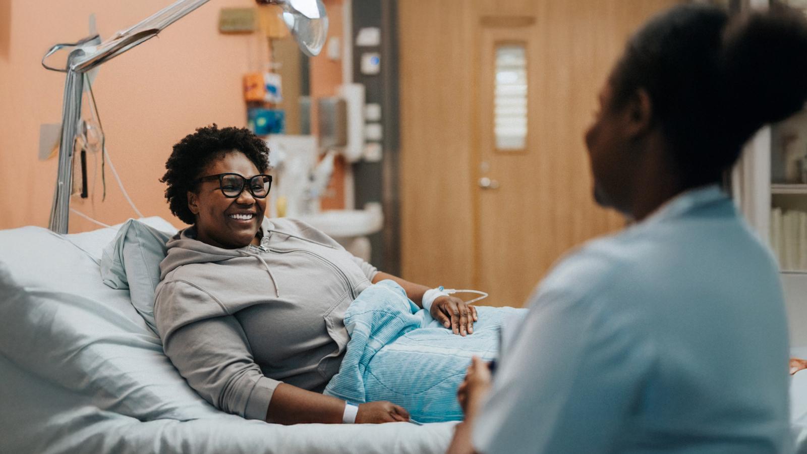 Woman in a hospital bed. Woman in a hospital bed.