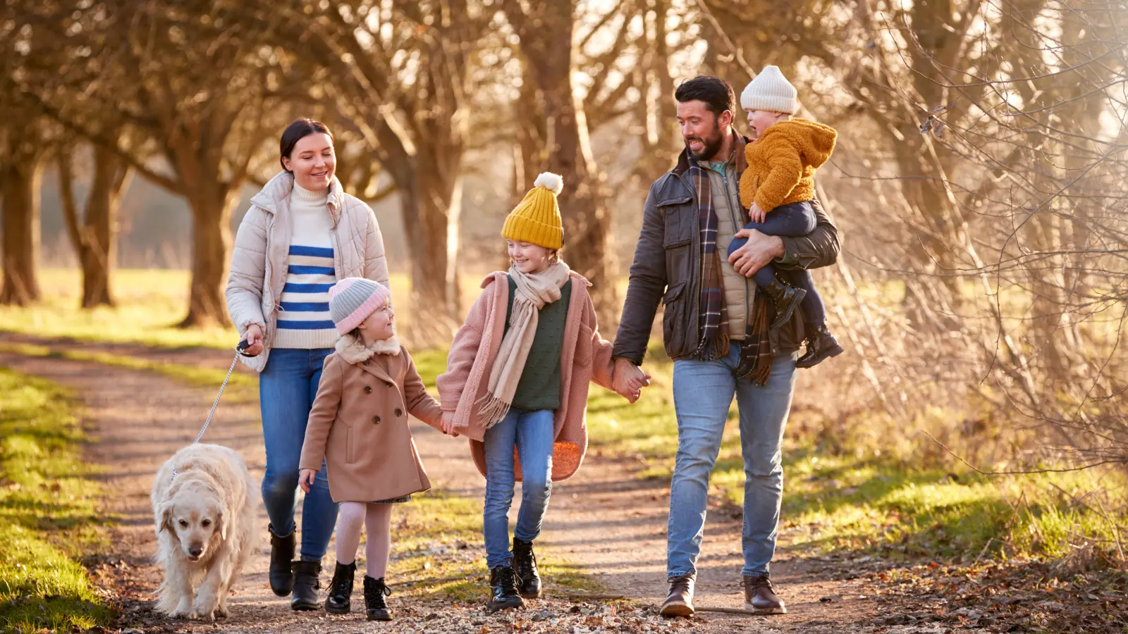 family-walking-with-pet-dog-1600x900