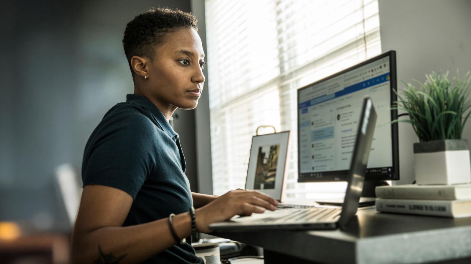 Woman working on desktop at home