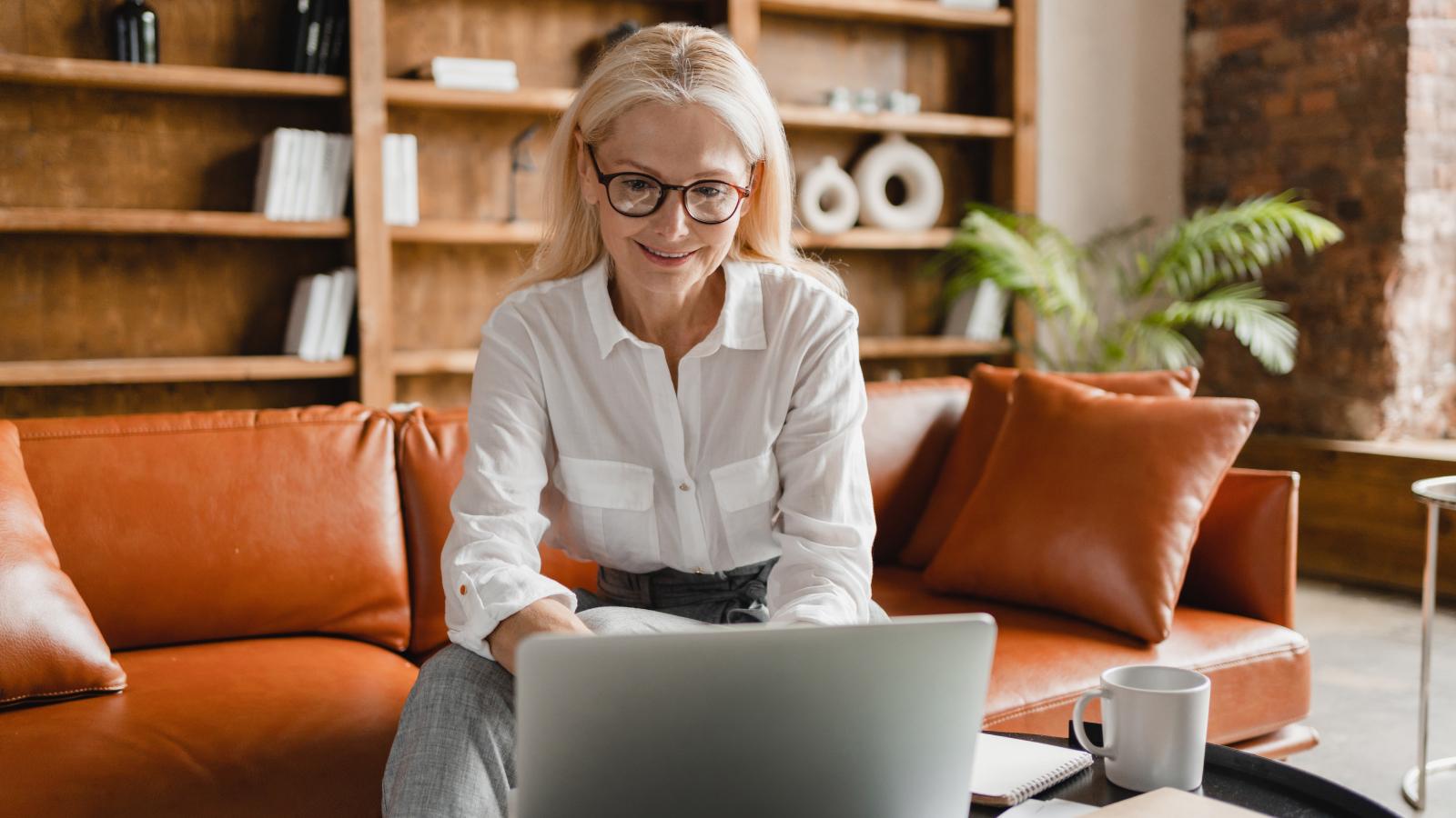 Businesswoman working remotely on laptop