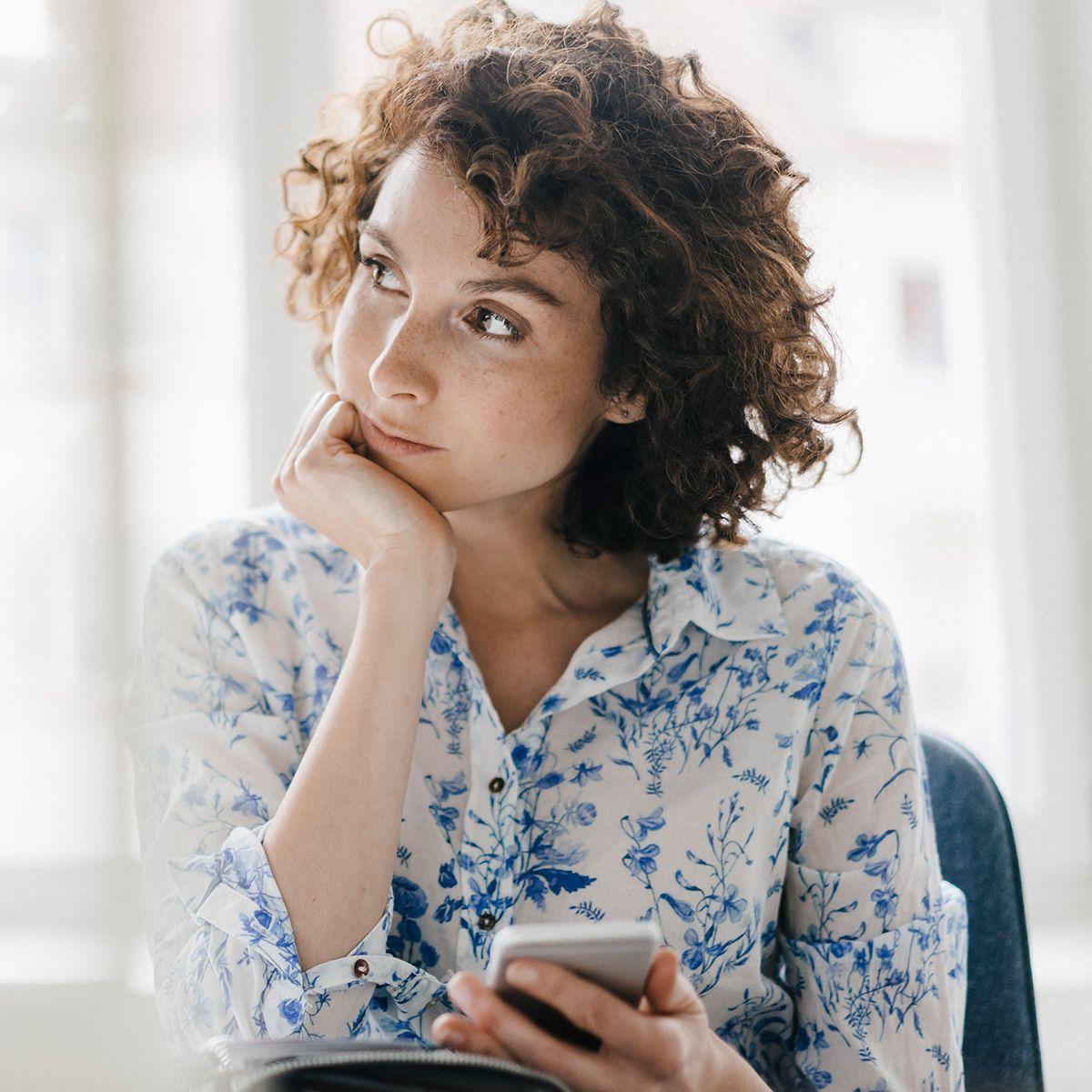Woman deciding on her critical illness insurance plans.