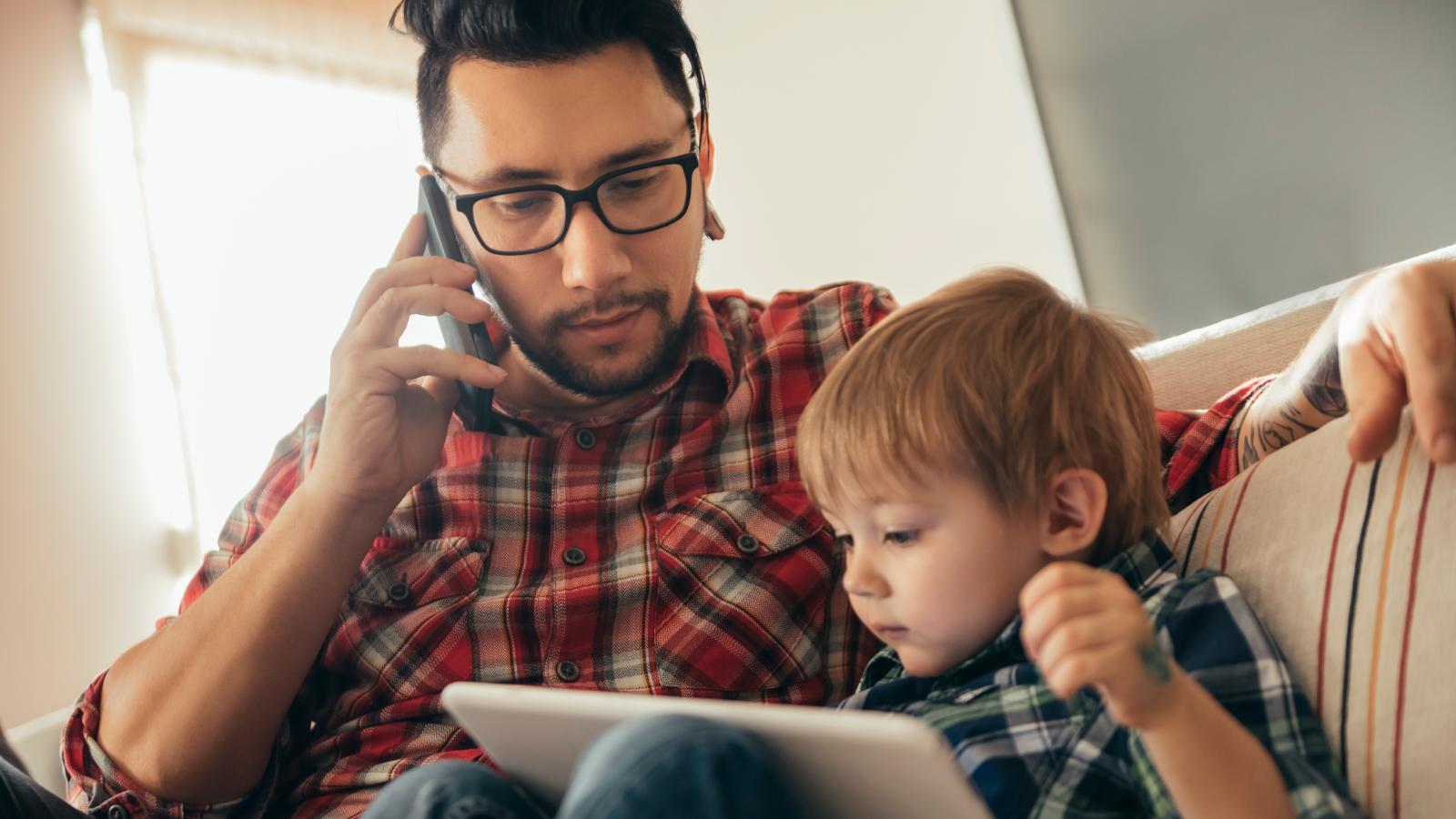 Father and son using tablet