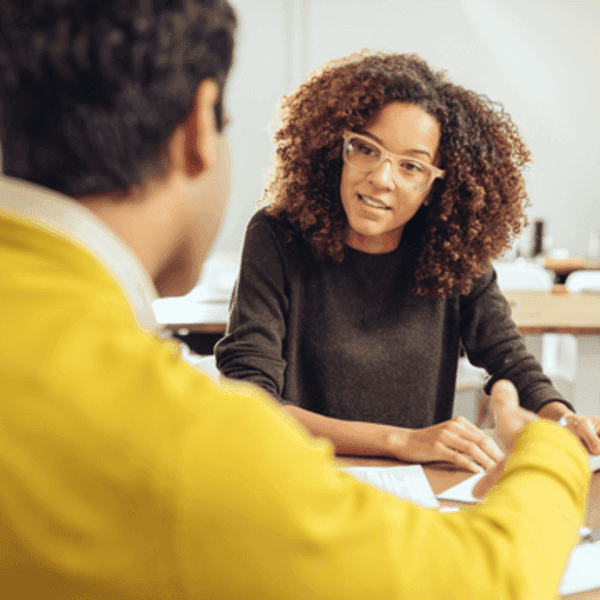 Woman talking to a client.