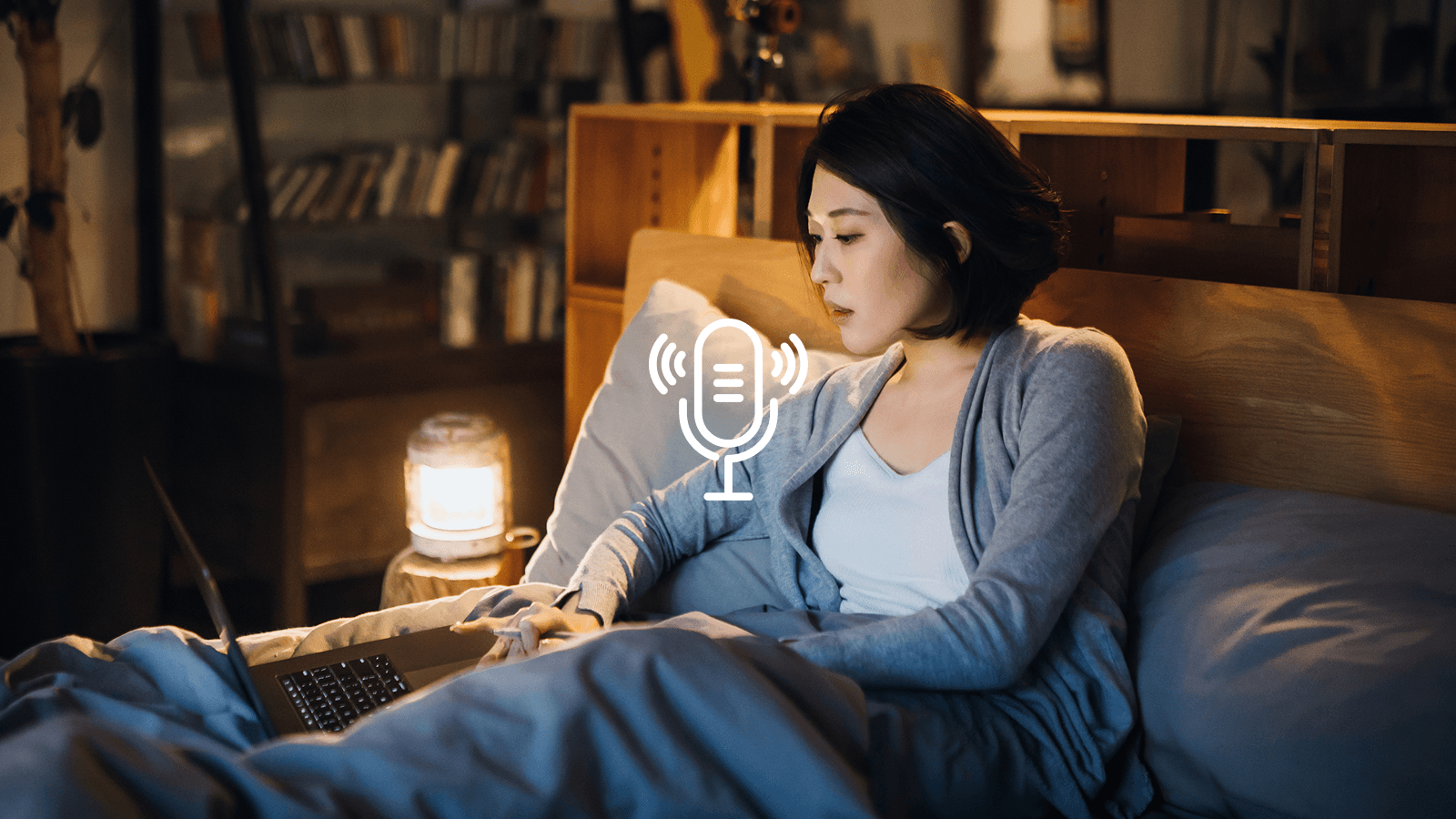Woman listening podcast on laptop