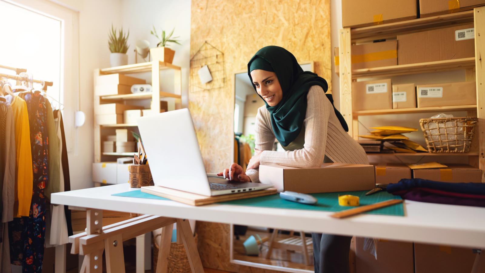 Small business owner working on laptop Small business owner working on laptop