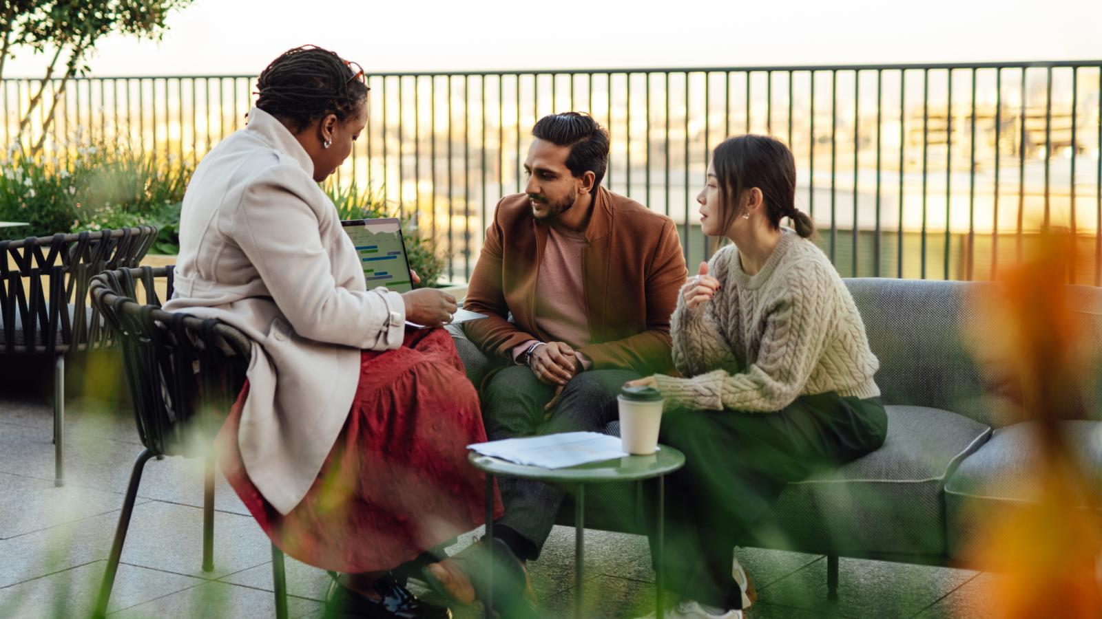 Couple discussing in meeting at rooftop