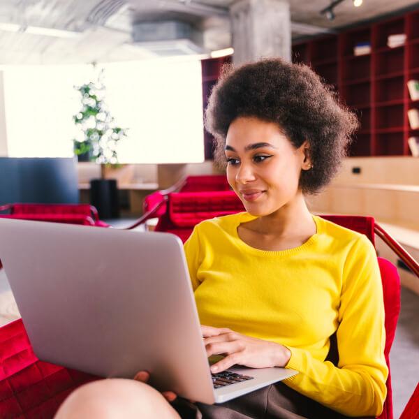 Young business woman using her laptop in the office.
