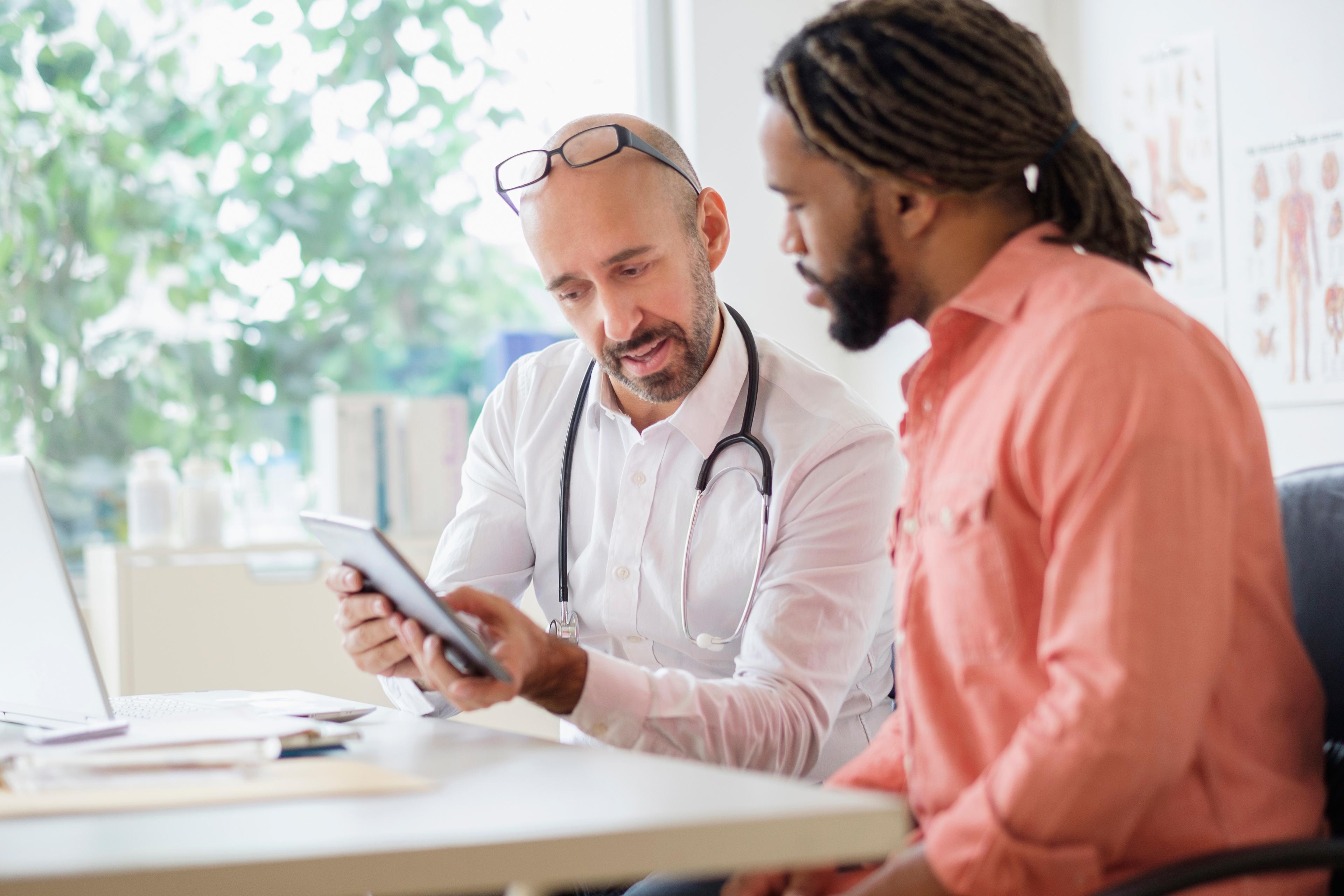 Man speaking with his doctor.