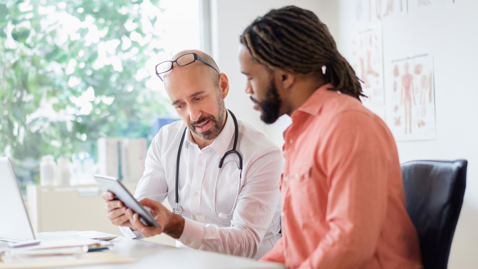Doctor giving consultation to patient
