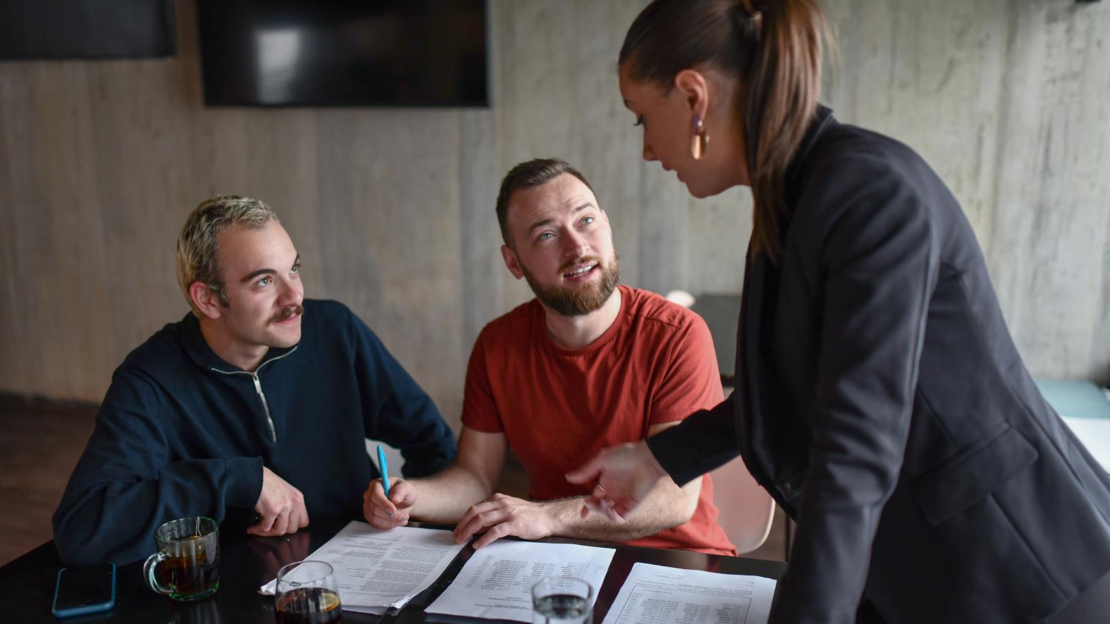 Two men meeting with financial professional