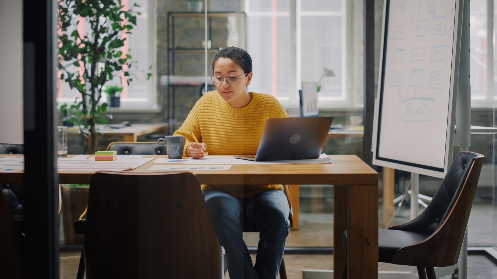 Marketing specialist is working on laptop