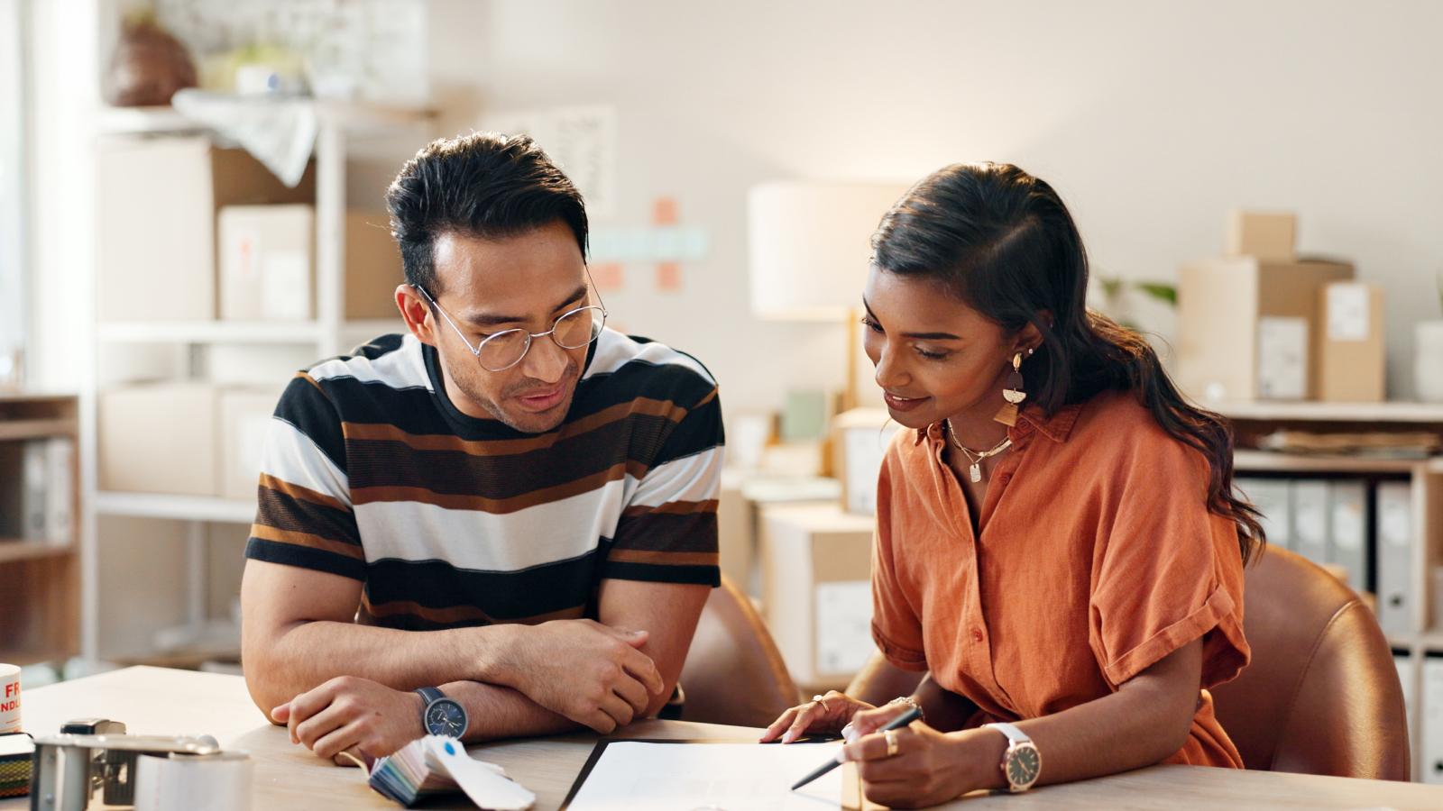 Woman training an employee with logistics